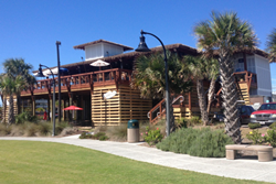 sharkeys beach bar exterior of restaurant with grass lawn and landscaping